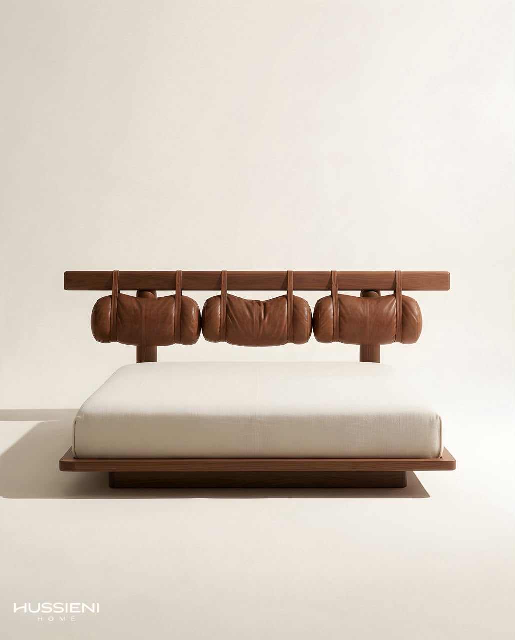 PILLO Hanging Bolster Bed in walnut with leather cushions - front view