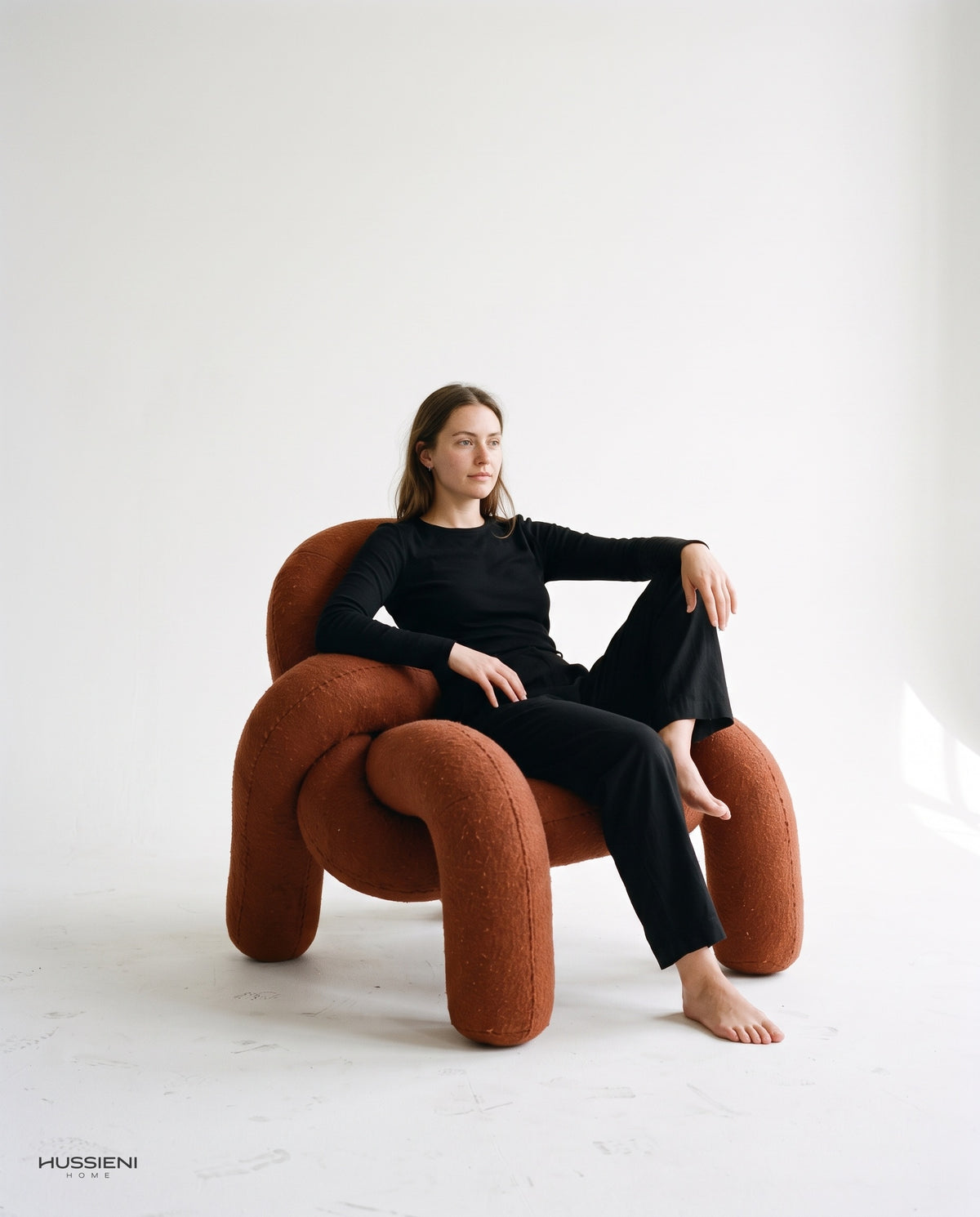 Knot Lounge Chair with model seated