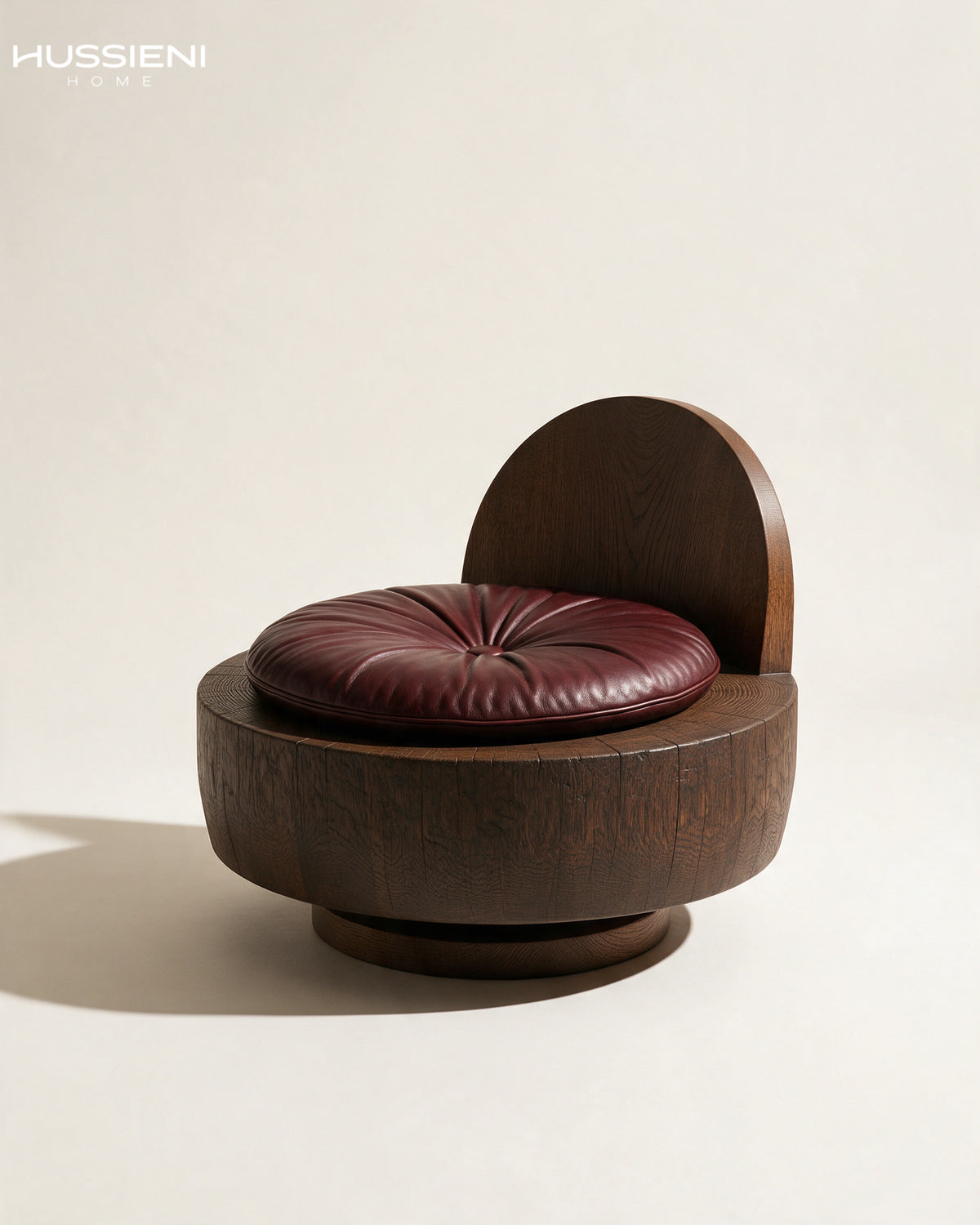 LUNE Swivel Lounge Chair in solid oak with burgundy leather cushion - angled view